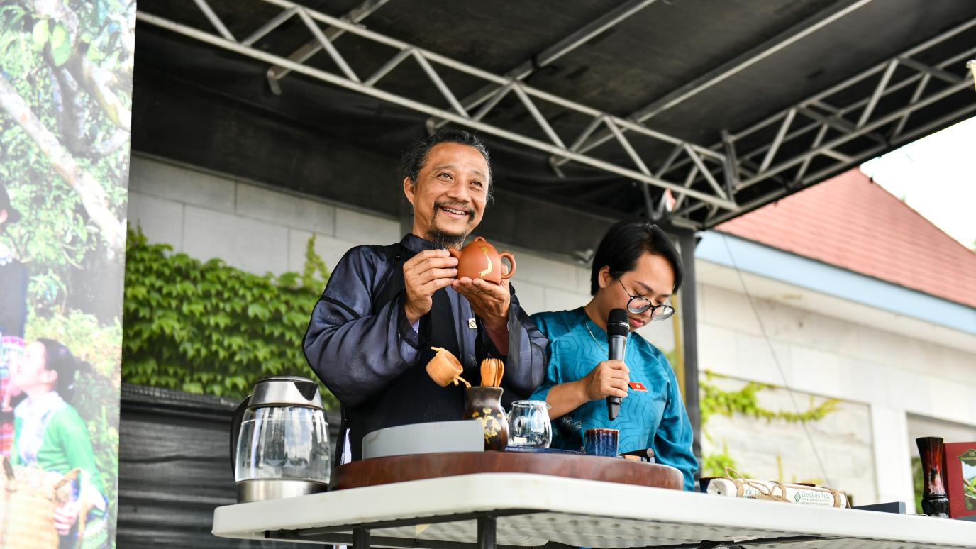 A traditional tea demonstration on stage at the 2025 Wellington County Multicultural Festival.
