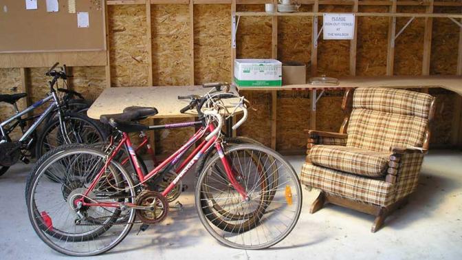 Bicycles and an arm chair inside the Reuse centre