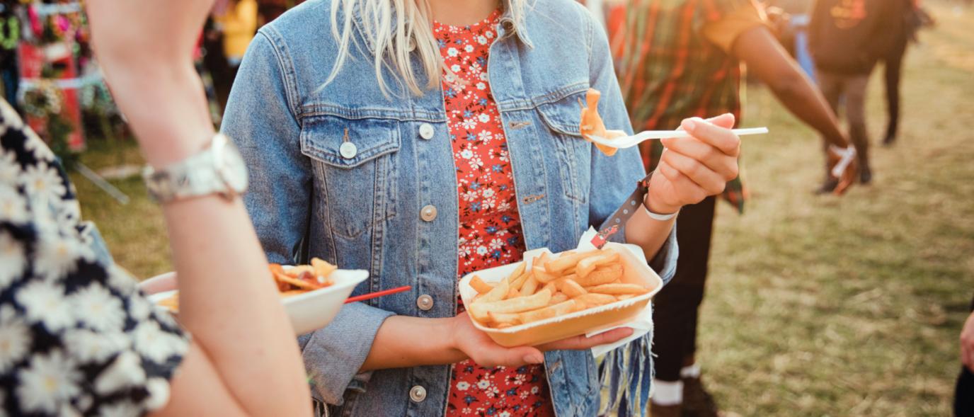 Woman Holding Fries to eat